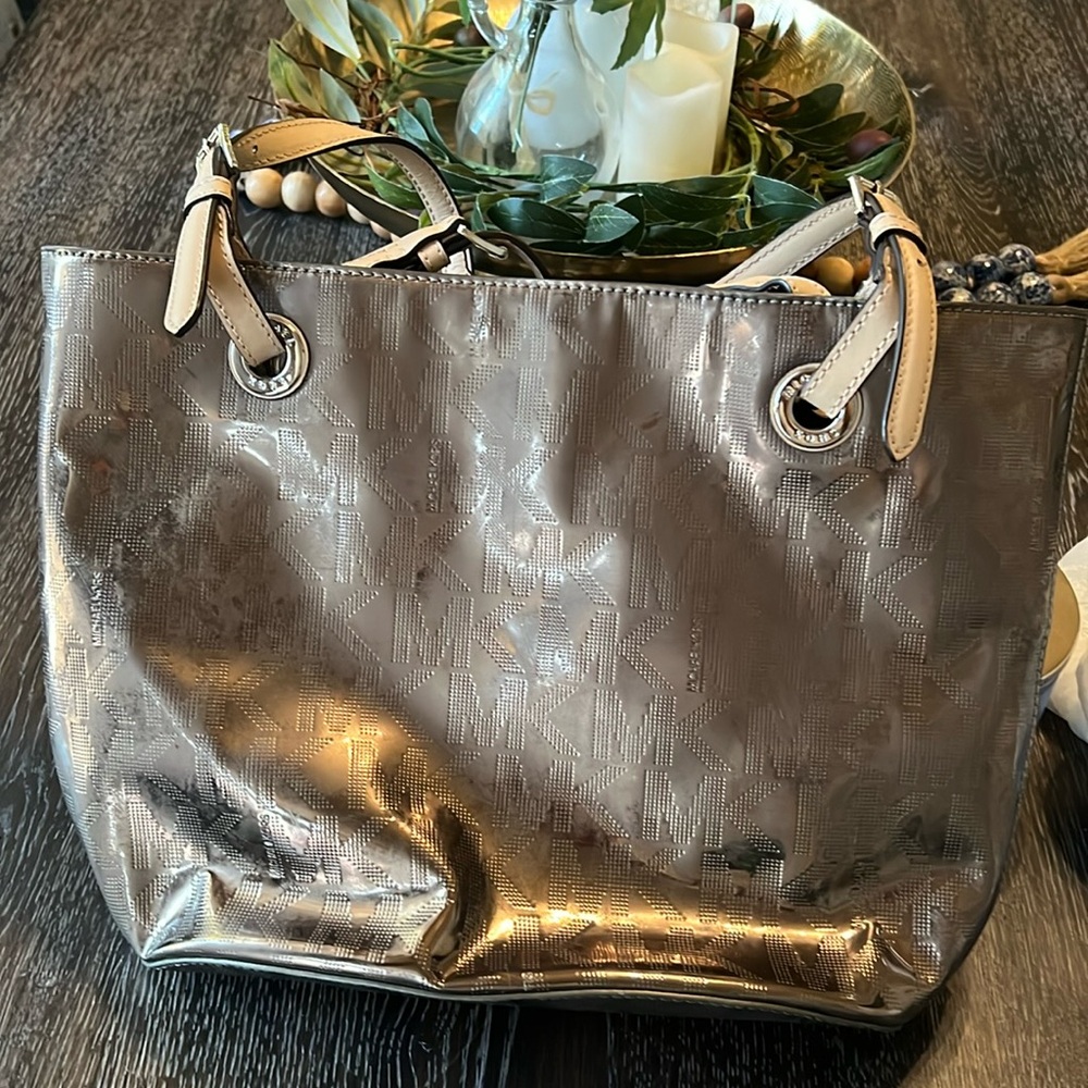 Michael Kors medium tote, bronze color with tan straps. Great condition.